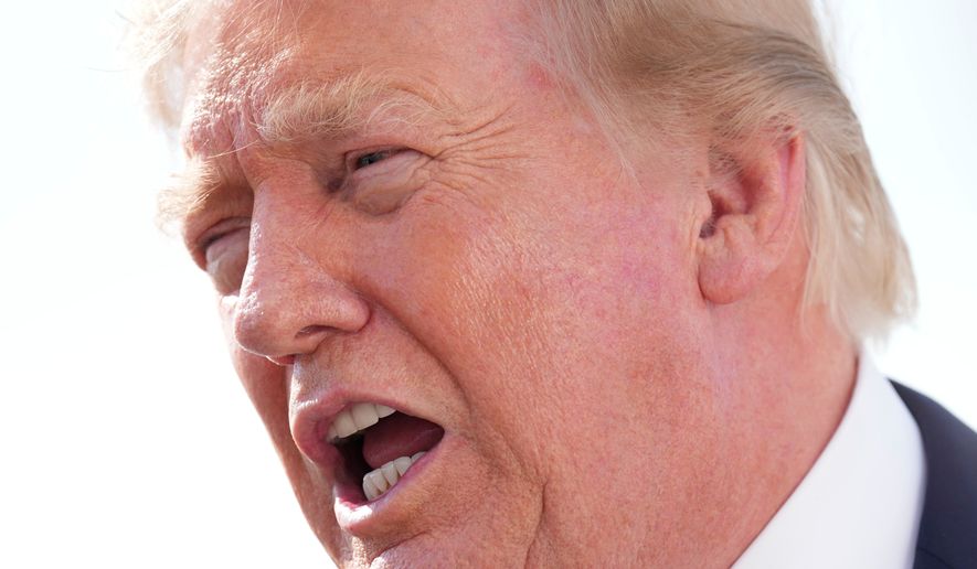 President Donald Trump speaks with reporters before boarding Air Force One, Friday, Aug. 21, 2026, at Joint Base Andrews, Md., en route to South Carolina. (AP Photo/Jacquelyn Martin)