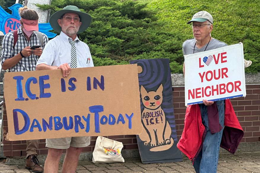 Anti-ICE activists gather outside a courthouse in Danbury, Conn., Thursday, Aug. 27, 2026. (AP Photo/Ted Shaffrey)