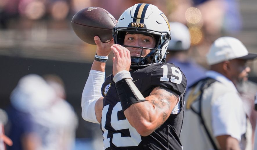 FILE - Vanderbilt quarterback Blaze Berlowitz warms up before an NCAA college football game, Sept. 27, 2025, in Nashville, Tenn. (AP Photo/George Walker IV, File)