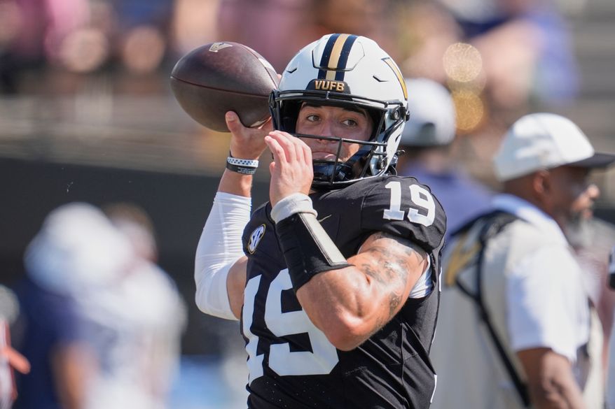 FILE - Vanderbilt quarterback Blaze Berlowitz warms up before an NCAA college football game, Sept. 27, 2025, in Nashville, Tenn. (AP Photo/George Walker IV, File)