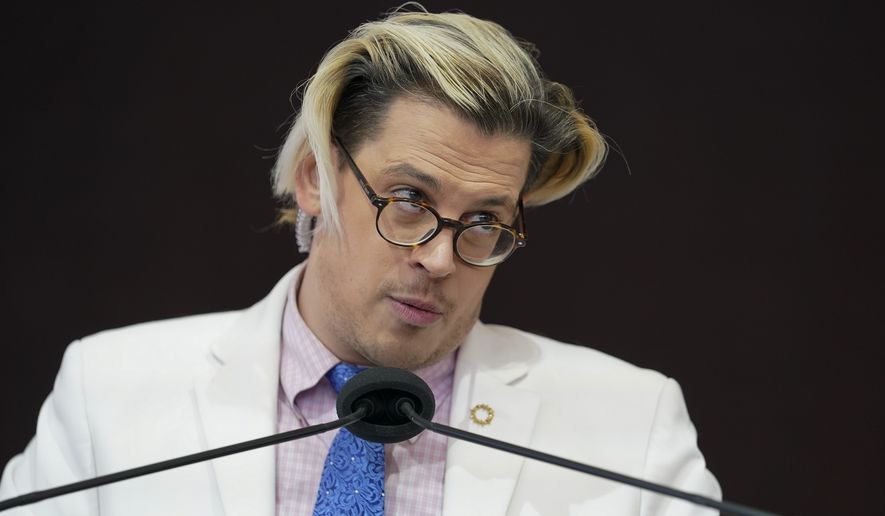 Activist Milo Yiannopoulos speaks during a rally outside of the Baltimore hotel where the United States Conference of Catholic Bishops are holding its Fall General Assembly meeting, Tuesday, Nov. 16, 2021, in Baltimore.(AP Photo/Julio Cortez)