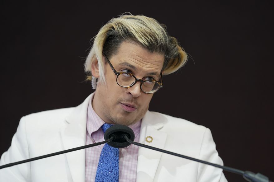 Activist Milo Yiannopoulos speaks during a rally outside of the Baltimore hotel where the United States Conference of Catholic Bishops are holding its Fall General Assembly meeting, Tuesday, Nov. 16, 2021, in Baltimore.(AP Photo/Julio Cortez)