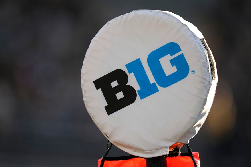 FILE - The Big Ten Conference logo sits atop a down marker during the first half of an NCAA college football game between Iowa and Michigan State, Sept. 30, 2023, in Iowa City, Iowa. (AP Photo/Charlie Neibergall, File)