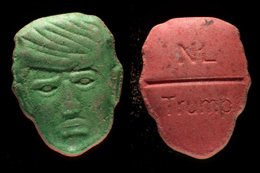 This undated photo provided by Trimbos Institute of Mental Health and Addiction shows pills that have a depiction of President Donald Trump on one side and on the other side NL and Trump stamped into the surface. (Trimbos Institute of Mental Health and Addiction via AP)