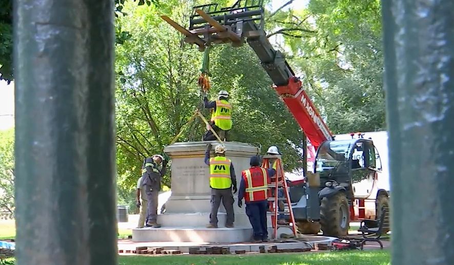 This image taken from a WRIC video shows workers attaching straps to a Confederate statue as they prepare to remove it from Capitol Square in Richmond, Va., on Friday, Aug. 28, 2026. (Courtesy WRIC)