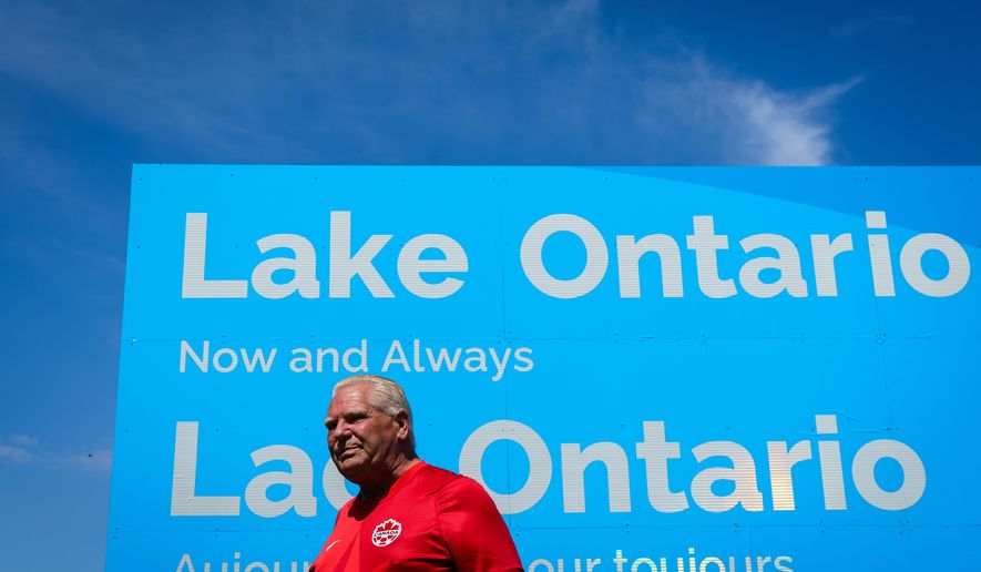Ontario Premier Doug Ford unveils a sign for Lake Ontario at Fifty Point Conservation Area in Grimsby, Ontario, Canada, on Saturday, Aug. 29, 2026. (Keito Newman/The Canadian Press via AP)