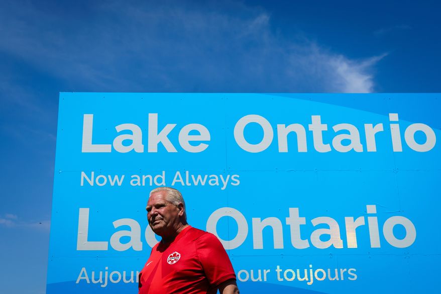 Ontario Premier Doug Ford unveils a sign for Lake Ontario at Fifty Point Conservation Area in Grimsby, Ontario, Canada, on Saturday, Aug. 29, 2026. (Keito Newman/The Canadian Press via AP)