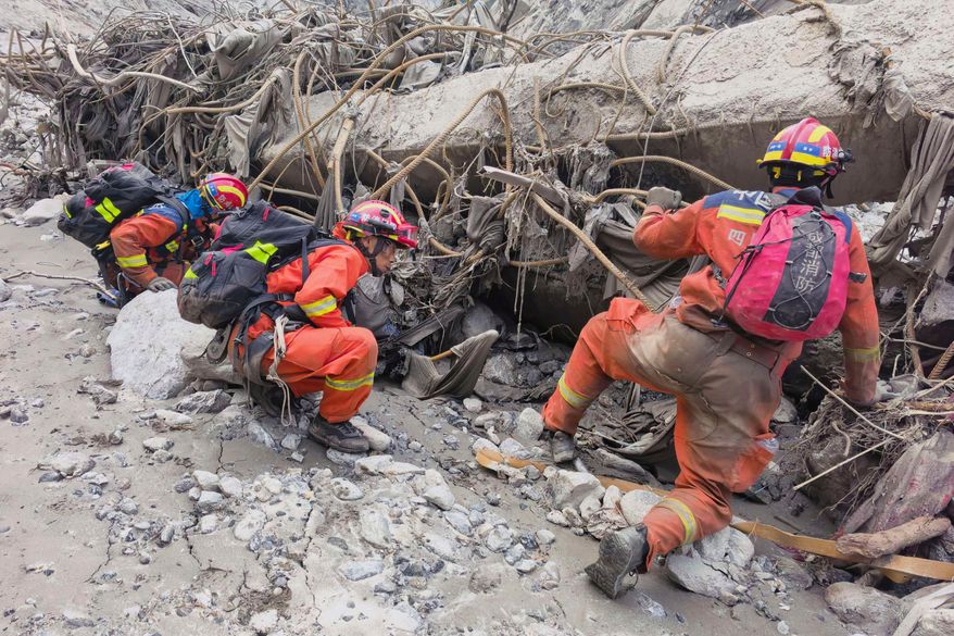 In this photo released by Xinhua News Agency, rescuers carry out search and rescue operations at the mudslide-hit area in Gyirong County, southwest China's Tibet Autonomous Region on Saturday, Aug. 29, 2026. (Zheng Lijun/Xinhua via AP)