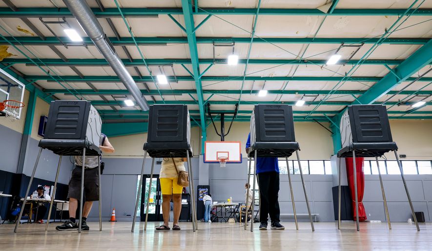 Voters cast their ballots during the primary election in Windsor, Conn., Aug. 11, 2026. (AP Photo/Rusty Jones, File)