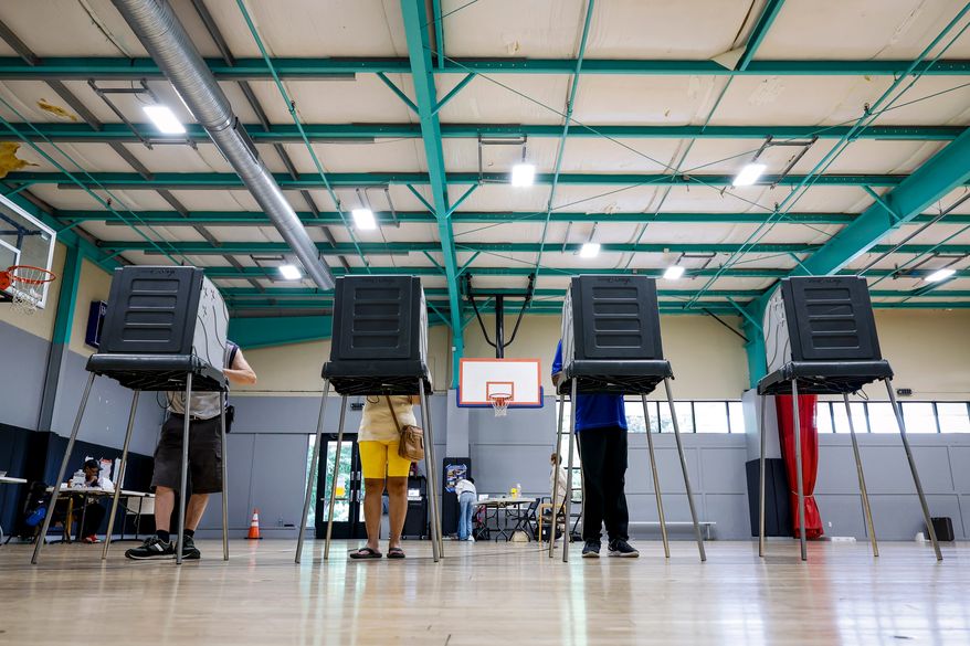 Voters cast their ballots during the primary election in Windsor, Conn., Aug. 11, 2026. (AP Photo/Rusty Jones, File)
