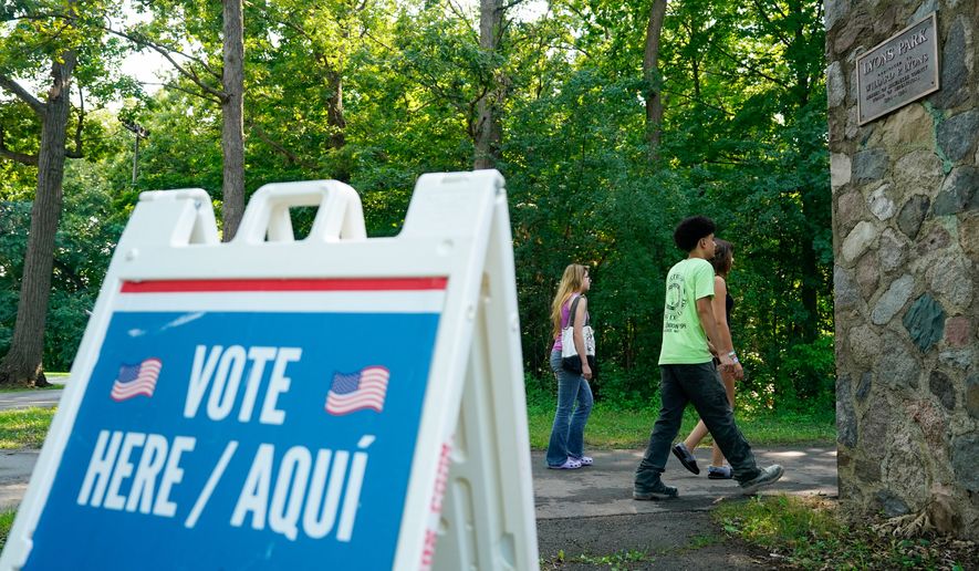Voters arrive to cast their ballots at Lyons Park in Milwaukee on primary Election Day, Aug. 11, 2026. (AP Photo/Kayla Wolf) **FILE**