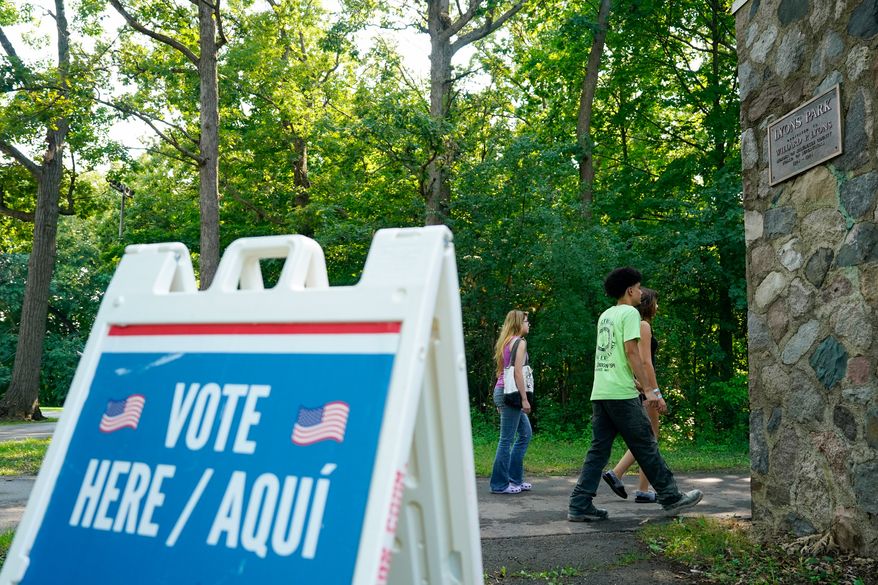 Voters arrive to cast their ballots at Lyons Park in Milwaukee on primary Election Day, Aug. 11, 2026. (AP Photo/Kayla Wolf) **FILE**