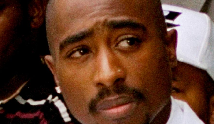 Rapper Tupac Shakur attends a voter registration event in South Central Los Angeles, Aug. 15, 1996. (AP Photo/Frank Wiese, File)