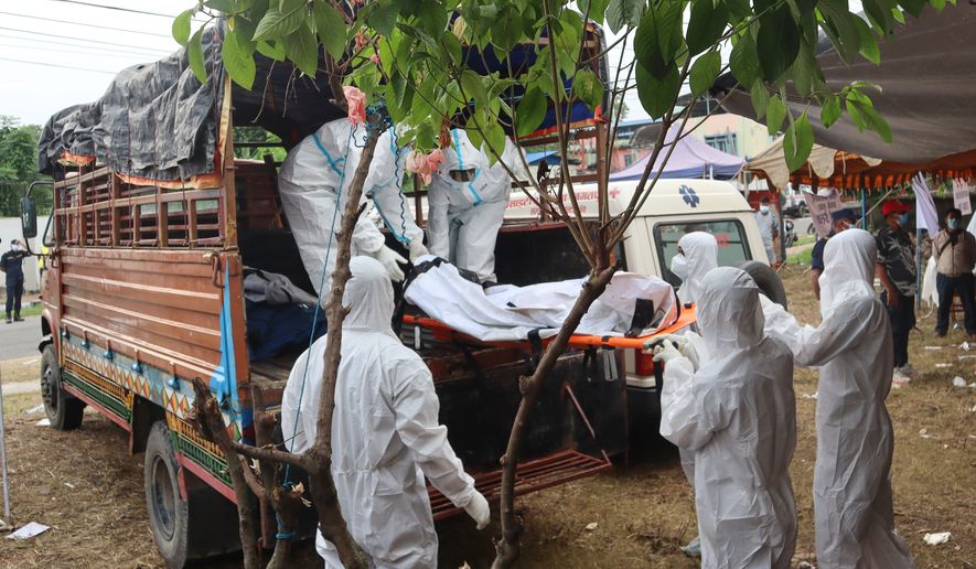 Rescuers carry bodies of flash flood victims for a mass burial in Chitwan, Nepal, Saturday, Aug. 29, 2026. (AP Photo/Nisha Shrestha)