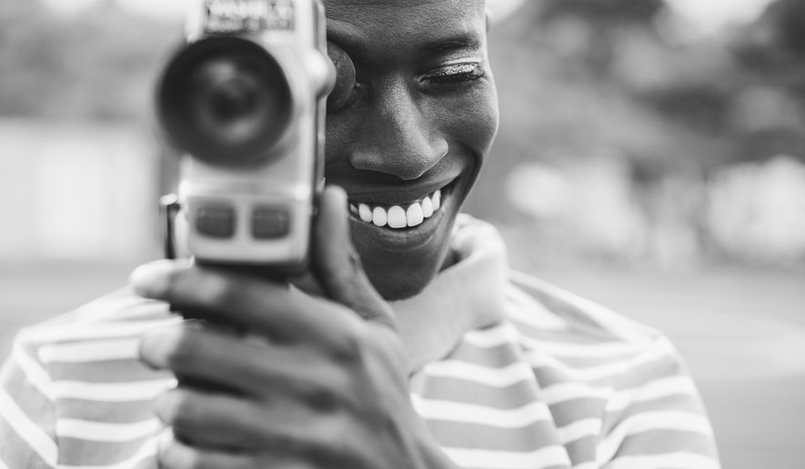 More young Americans are opting for vintage cameras rather than the ultra-crisp lenses that come with their smartphones. (Photo by DisobeyArt on Shutterstock)