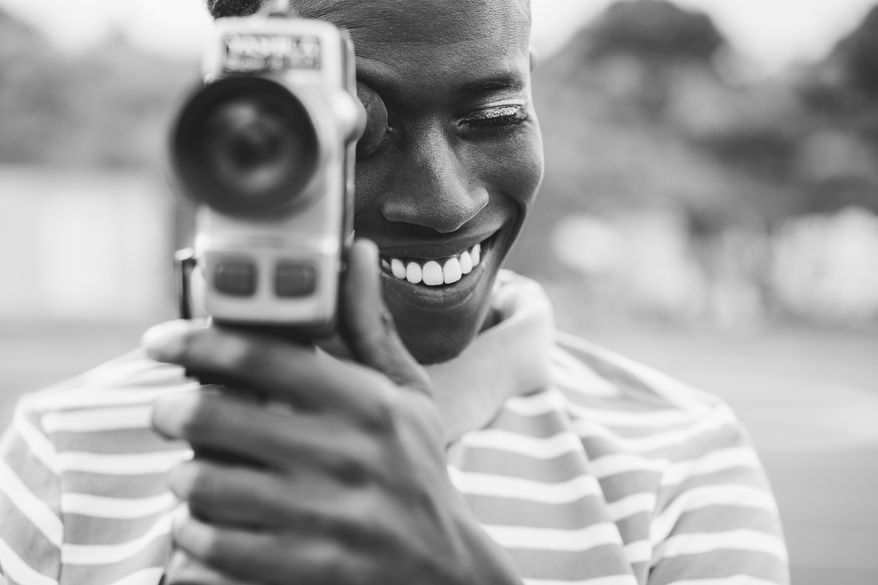 More young Americans are opting for vintage cameras rather than the ultra-crisp lenses that come with their smartphones. (Photo by DisobeyArt on Shutterstock)