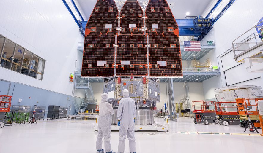 This photo provided by NASA shows technicians connecting the inner and outer segments of NASA's Nancy Grace Roman Space Telescope, Nov. 25, 2025, at NASA’s Goddard Space Flight Center in Greenbelt, Md. (Jolearra Tshiteya/NASA via AP)