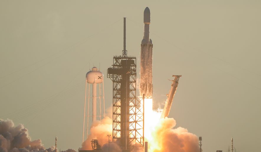 A SpaceX Falcon Heavy rocket with the space observatory Roman Telescope lifts off from launch complex 39A at the Kennedy Space Center in Cape Canaveral, Fla., Sunday, Aug. 30, 2026. (AP Photo/John Raoux)