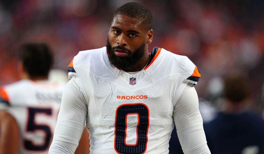 Denver Broncos linebacker Jonathon Cooper walks on the sideline during the first half of a preseason NFL football game against the Minnesota Vikings, Friday, Aug. 28, 2026, in Denver. (AP Photo/Jack Dempsey)