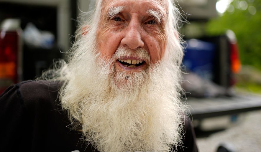 Grey Beard is a fitting trail name for 91-year-old Appalachian Trail hiker Dale Sanders, seen enjoying a rest, Wednesday, July 29, 2026, north of Monson, Maine. (AP Photo/Robert F. Bukaty)