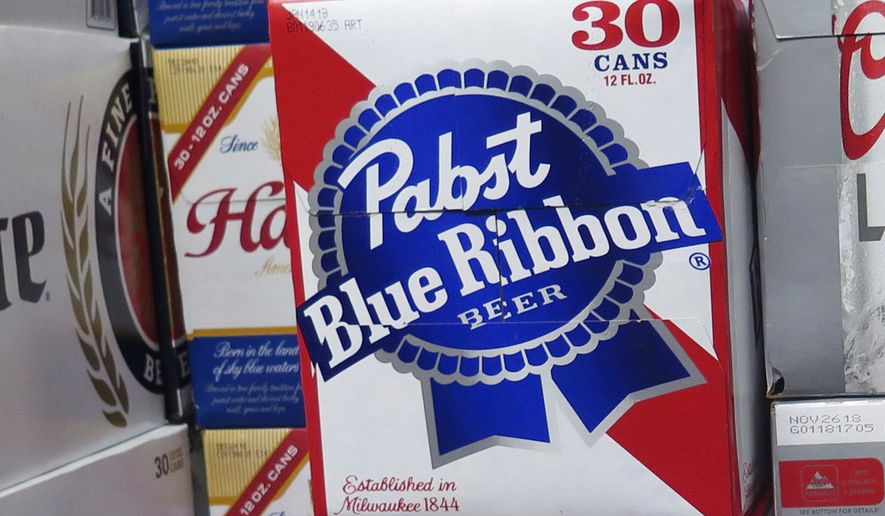 FILE - Cases of Pabst Blue Ribbon beer are stacked in a liquor store, Nov. 8, 2018, in Milwaukee. (AP Photo/Ivan Moreno, File)