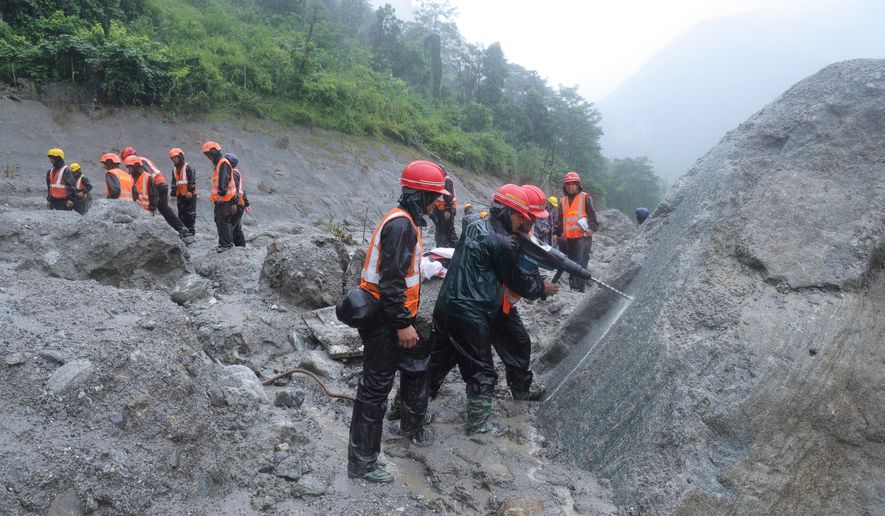 This photo provided by the Nepal Army, shows Nepal army soldiers using a drilling machine during a rescue operation at the site of a hydropower project in Upper Trishuli, Nepal, Sunday, Aug. 30, 2026. (Nepal Army via AP)