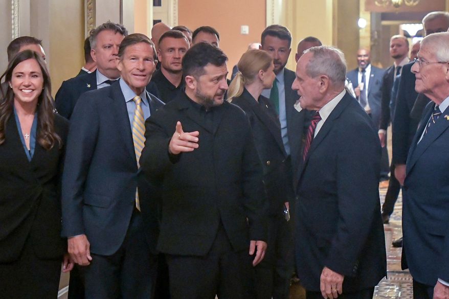 Ukraine's President Volodymyr Zelenskyy, center, is joined by from left: Sen. Katie Britt, R-Ala., Sen. Richard Blumenthal, D-Conn., Sen. James Risch, R-Idaho, and Sen. Roger Wicker, R-Miss., as he arrives at the U.S. Capitol for a meeting of bipartisan leaders of the Lindsey O. Graham Sanctioning Russia and Iran Act of 2026, July 28, 2026, in Washington. (AP Photo/Rod Lamkey, Jr., File)