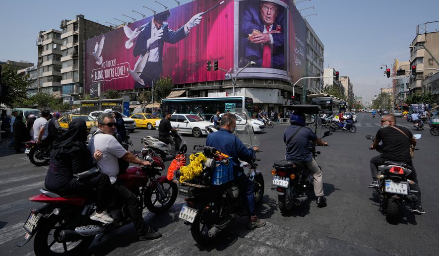 Vehicles pass a billboard depicting U.S. President Donald Trump inside a catering container alongside a magician and the words "No tricks! Blink, you're gone," in downtown Tehran, Iran, Monday, Aug. 31, 2026. (AP Photo/Vahid Salemi)