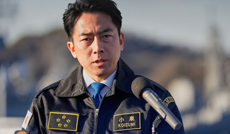Japan's Defense Minister Shinjiro Koizumi speaks with media at the headquarters of the Japan Maritime Self-Defense Force Yokosuka District, south of Tokyo, on Jan. 30, 2026. (AP Photo/Eugene Hoshiko, Pool, File)