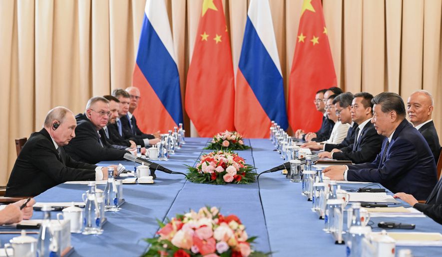 Russian President Vladimir Putin, left, and China's President Xi Jinping attend a meeting on the sidelines of the Shanghai Cooperation Organization (SCO), in Bishkek, Kyrgyzstan, on Monday, Aug. 31, 2026. (Kristina Solovyova, Sputnik, Kremlin Pool Photo via AP)