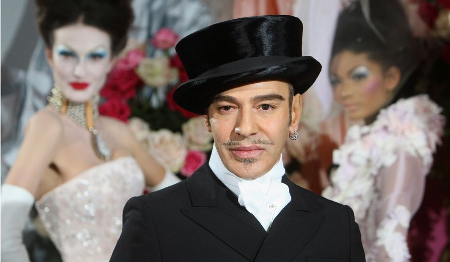 FILE - Fashion designer John Galliano poses at the end of the presentation of the Dior Haute Couture spring/summer 2010 fashion collection on Jan. 25, 2010, in Paris. (AP Photo/Jacques Brinon, File)