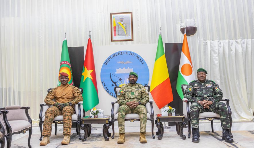 FILE - Captain Ibrahim Traoré of Burkina Faso, left, General Assimi Goïta of Mali, center, and General Abdourahamane Tchiani of Niger attend the second summit on security and development in Bamako, Mali, Tuesday, Dec. 23, 2025. (Mali Government Information Center via AP, File)