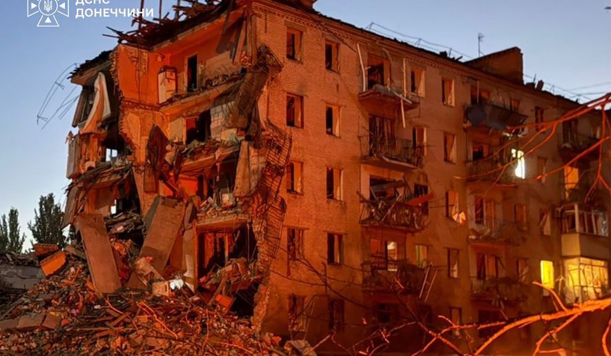 This photo provided by the Ukrainian Emergency Service shows a site of a residential building damaged by a Russian guided bomb in the city center of Sloviansk, Donetsk region, Ukraine, Monday, Aug. 31, 2026. (Ukrainian Emergency Service via AP)
