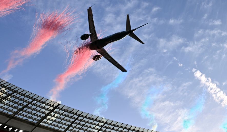 A jetliner flies over the stadium ahead of a second Test rugby match between South Africa and New Zealand, in Cape Town, South Africa, Saturday, Aug. 29, 2026. (AP Photo)