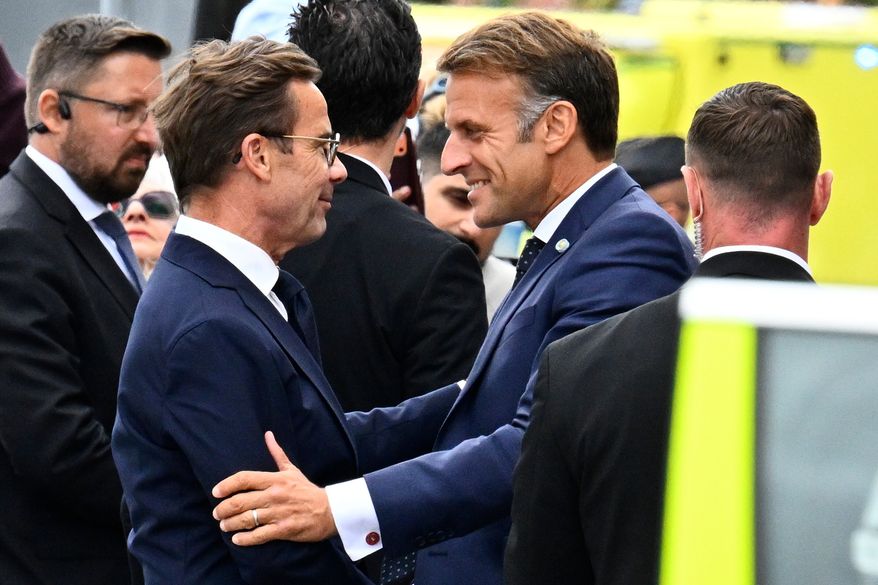 French President Emmanuel Macron, right, is welcomed by Swedish Prime Minister Ulf Kristersson, in Stockholm, Sweden, Monday, Aug. 31, 2026. (Anders Wiklund /TT News Agency via AP)