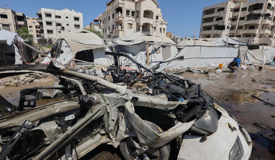 A destroyed vehicle is seen on a street following an Israeli military strike in Gaza City, Tuesday, Sept. 1, 2026. (AP Photo/Yousef Al Zanoun)