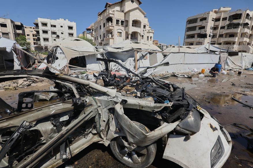 A destroyed vehicle is seen on a street following an Israeli military strike in Gaza City, Tuesday, Sept. 1, 2026. (AP Photo/Yousef Al Zanoun)