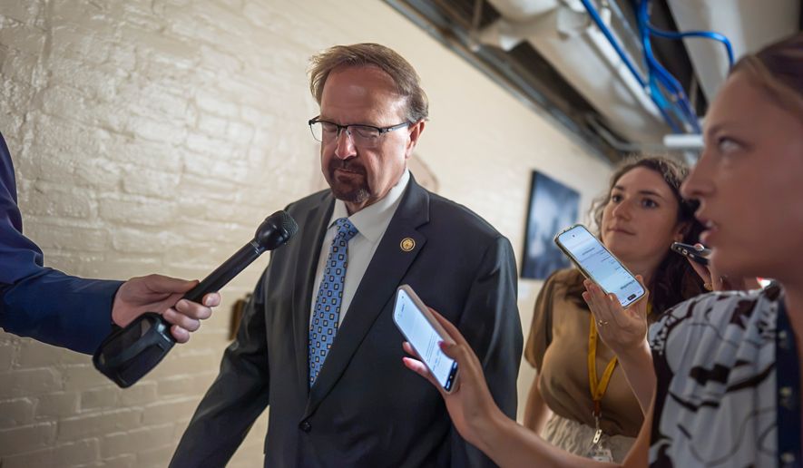 Rep. Chuck Edwards, R-N.C., who is under threat of censure, is met by reporters as he walks to a closed-door meeting with Republican lawmakers at the Capitol in Washington, Tuesday, Sept. 1, 2026. (AP Photo/J. Scott Applewhite)