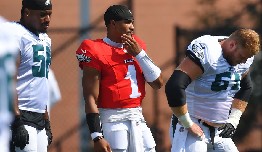 Philadelphia Eagles quarterback Jalen Hurts (1) pauses during a joint NFL football practice with the New England Patriots, Thursday, Aug. 20, 2026, in Foxborough, Mass. (AP Photo/Steven Senne)