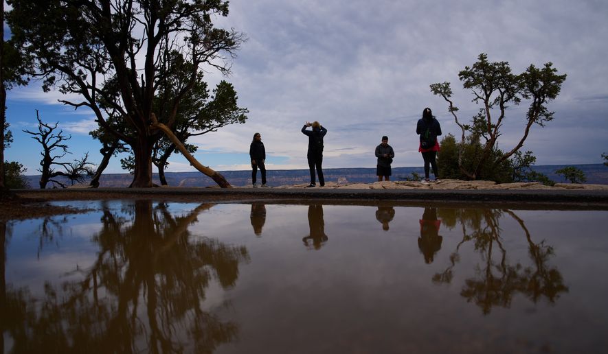 People stand at the rim of the Grand Canyon in Grand Canyon National Park, Ariz., on Monday, Aug. 31, 2026. (AP Photo/John Locher) **FILE**
