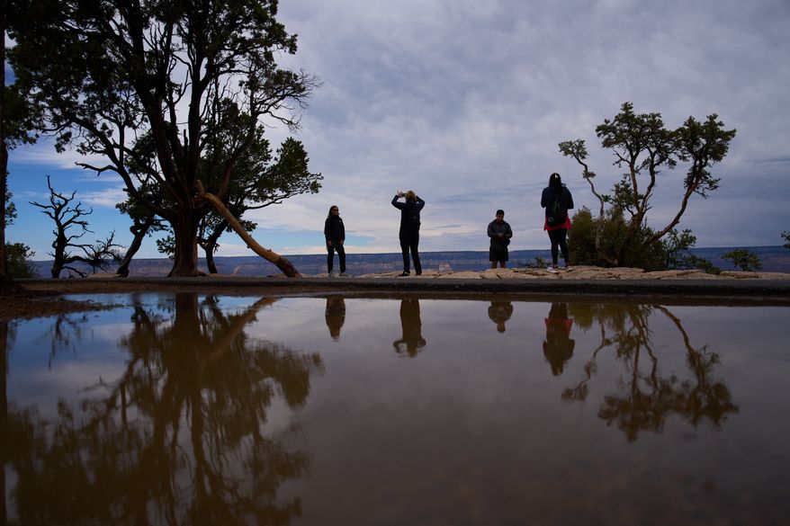 People stand at the rim of the Grand Canyon in Grand Canyon National Park, Ariz., on Monday, Aug. 31, 2026. (AP Photo/John Locher) **FILE**