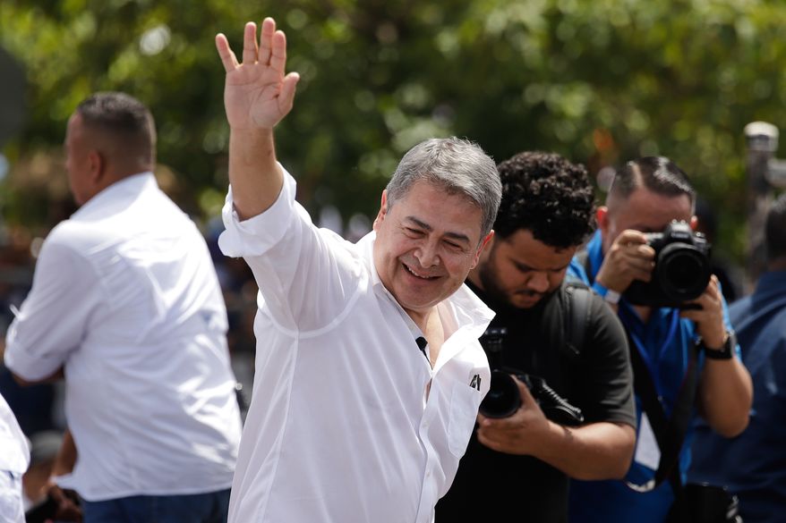FILE - Former Honduran President Juan Orlando Hernández waves after his arrival to Toncontin airport in Tagucigalpa, Honduras, Sunday, July 26, 2026. (AP Photo/Fernando Destephen,File)