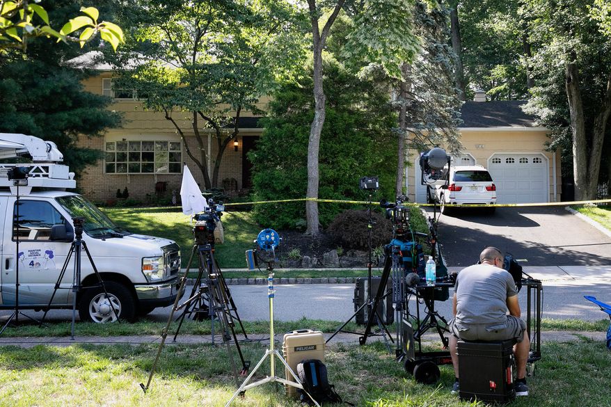FILE - News media is set up in front of the home of U.S. District Judge Esther Salas in North Brunswick, N.J., on Monday, July 20, 2020, after a gunman posing as a delivery person shot and killed Salas' 20-year-old son and wounded her husband Sunday evening. (AP Photo/Mark Lennihan, File)