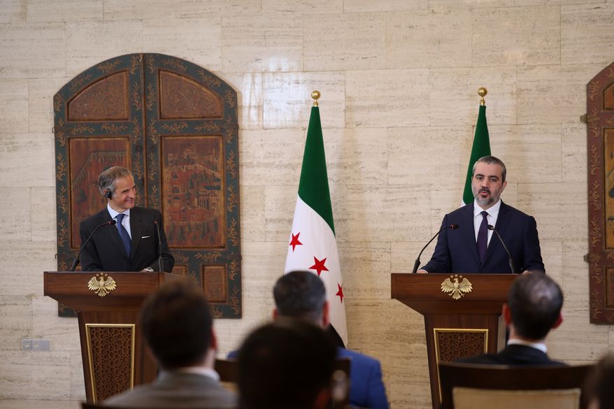 International Atomic Energy Agency's director-general Rafael Mariano Grossi, left, and Syrian Foreign Minister Asaad al-Shibani attend a press conference in Damascus, Syria, Tuesday Aug. 18, 2026. (AP Photo/Ghaith Alsayed)