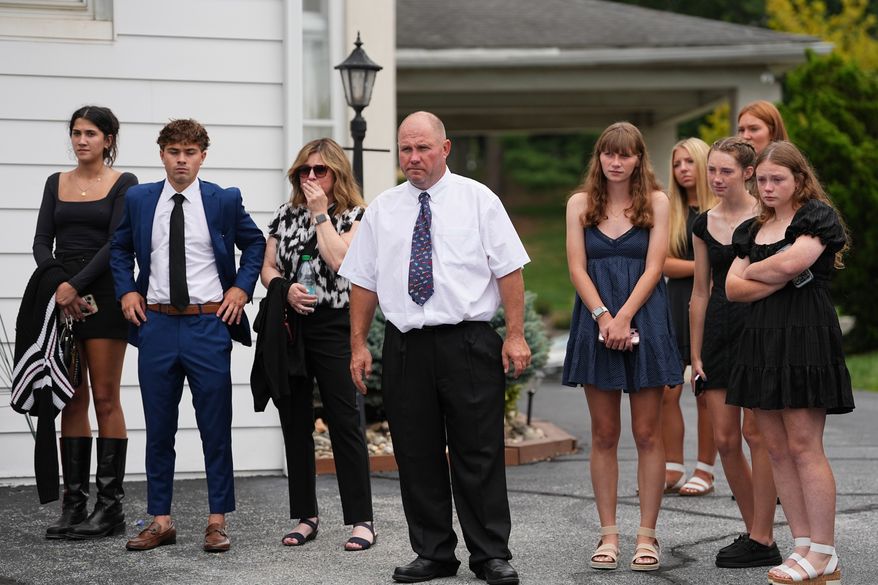 Glenwood Pysher III, watches as pallbearers carry a casket containing the remains of his son Glenwood "Bubba" Pysher IV who was killed by police, in Pottstown, Pa., Monday, Aug. 31, 2026. (AP Photo/Matt Rourke)