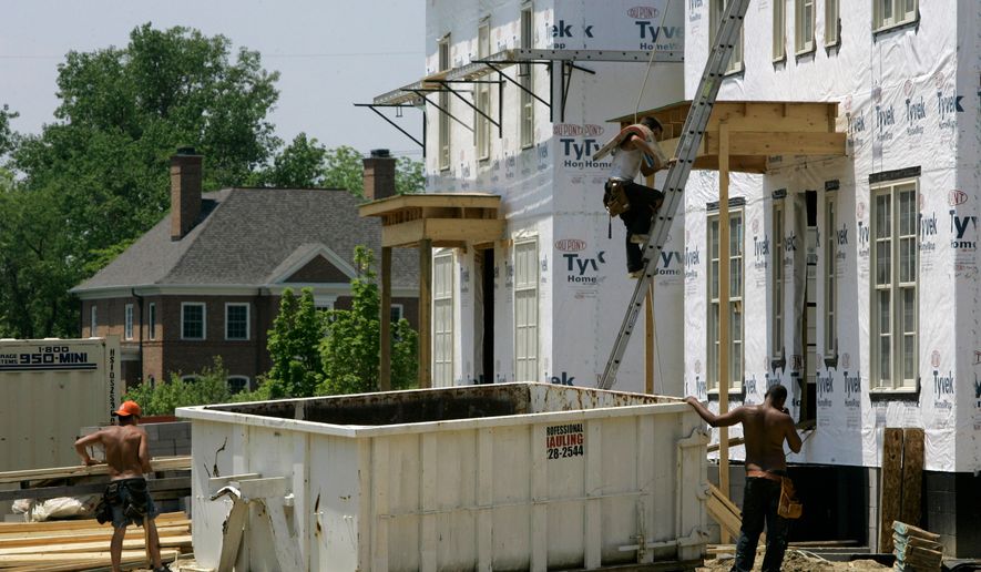 FILE - Luxury homes are under construction in a subdivision, May 22, 2007 in New Albany, Ohio. (AP Photo/Kiichiro Sato, File)