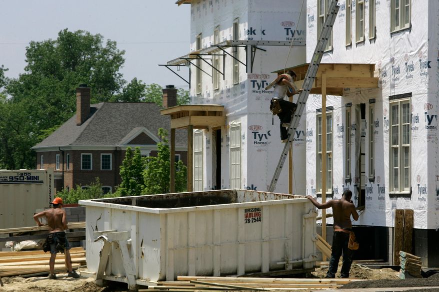 FILE - Luxury homes are under construction in a subdivision, May 22, 2007 in New Albany, Ohio. (AP Photo/Kiichiro Sato, File)
