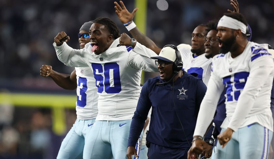 Dallas Cowboys offensive tackle Tyler Guyton (60) celebrates on the sideline after a two-point conversion against the New Orleans Saints during the second half of a preseason NFL football game, in Arlington, Texas, Friday, Aug. 28, 2026. (AP Photo/Gareth Patterson)