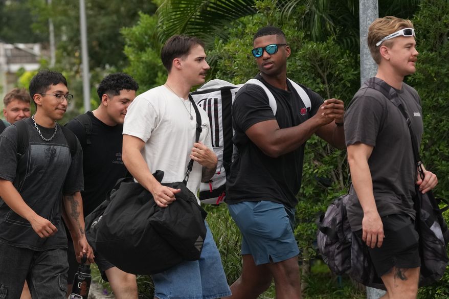 American service members from the USS Abraham Lincoln strike group arrive at a hotel in Pattaya, Thailand, Wednesday, Sept. 2, 2026. (AP Photo/Sakchai Lalit)