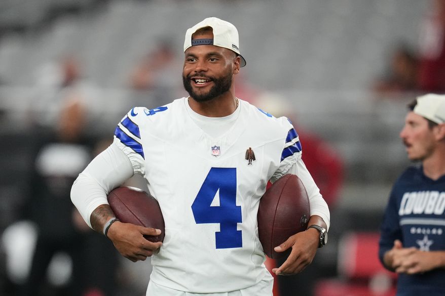 Dallas Cowboys quarterback Dak Prescott stands on the field during warmups before a preseason NFL football game against the Arizona Cardinals Saturday, Aug. 22, 2026, in Glendale, Ariz. (AP Photo/Rick Scuteri)